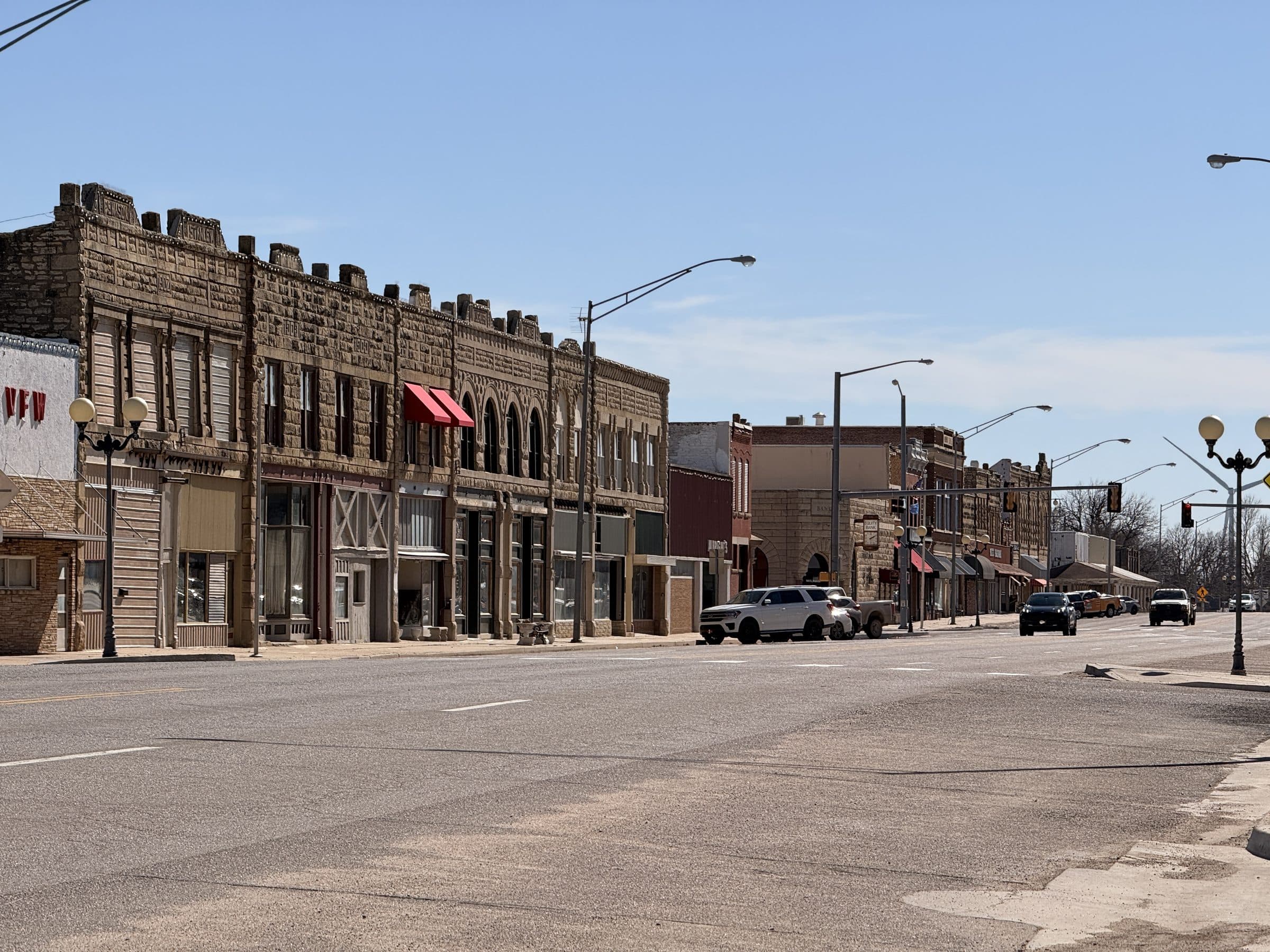 Historic stone and brick storefronts along the main street in Newkirk, Oklahoma